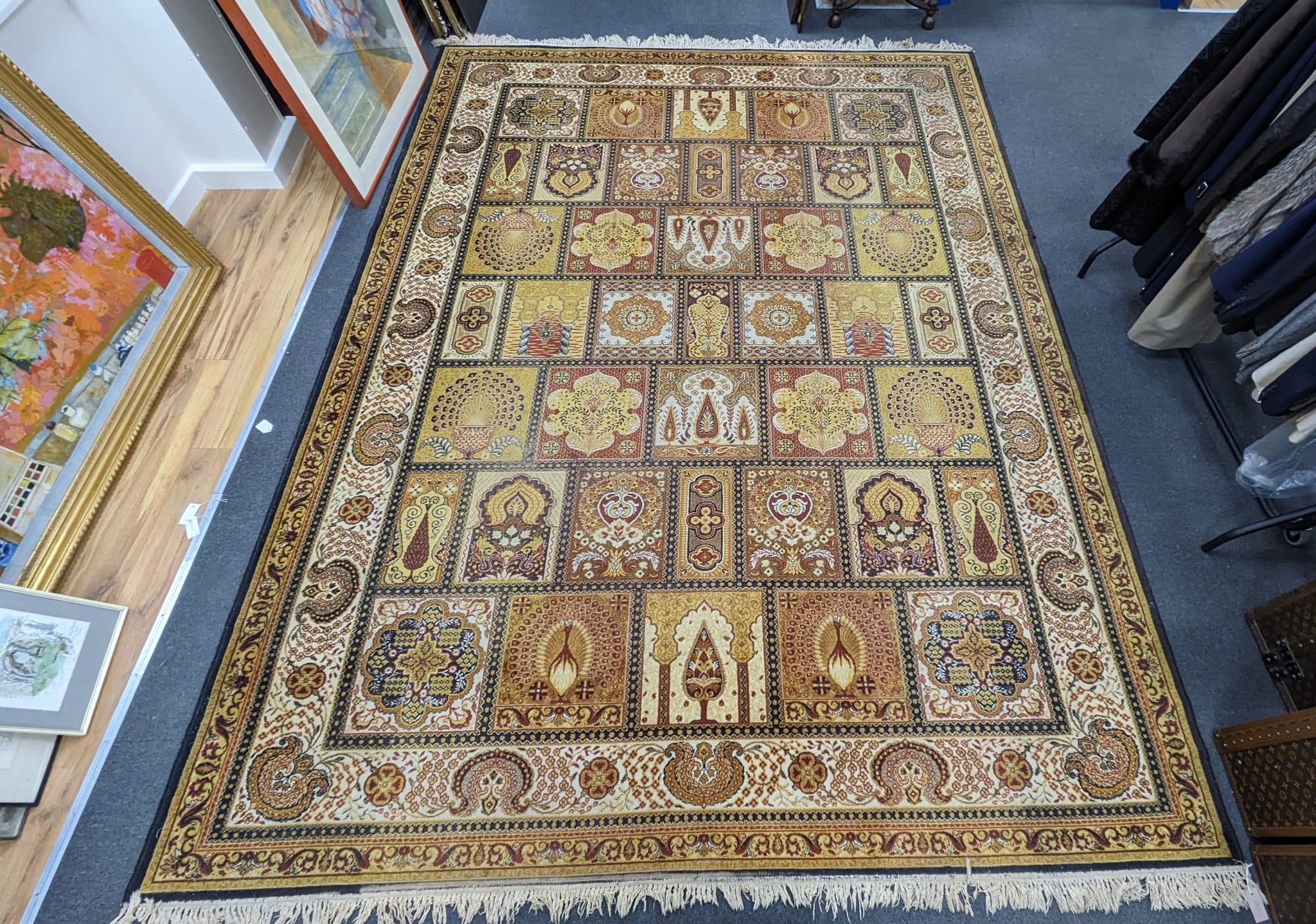 A Prado Orient 'Kashan Super' carpet with divided field of stylised flowers, peacocks and other motifs, multi-bordered, 372 x 275cm